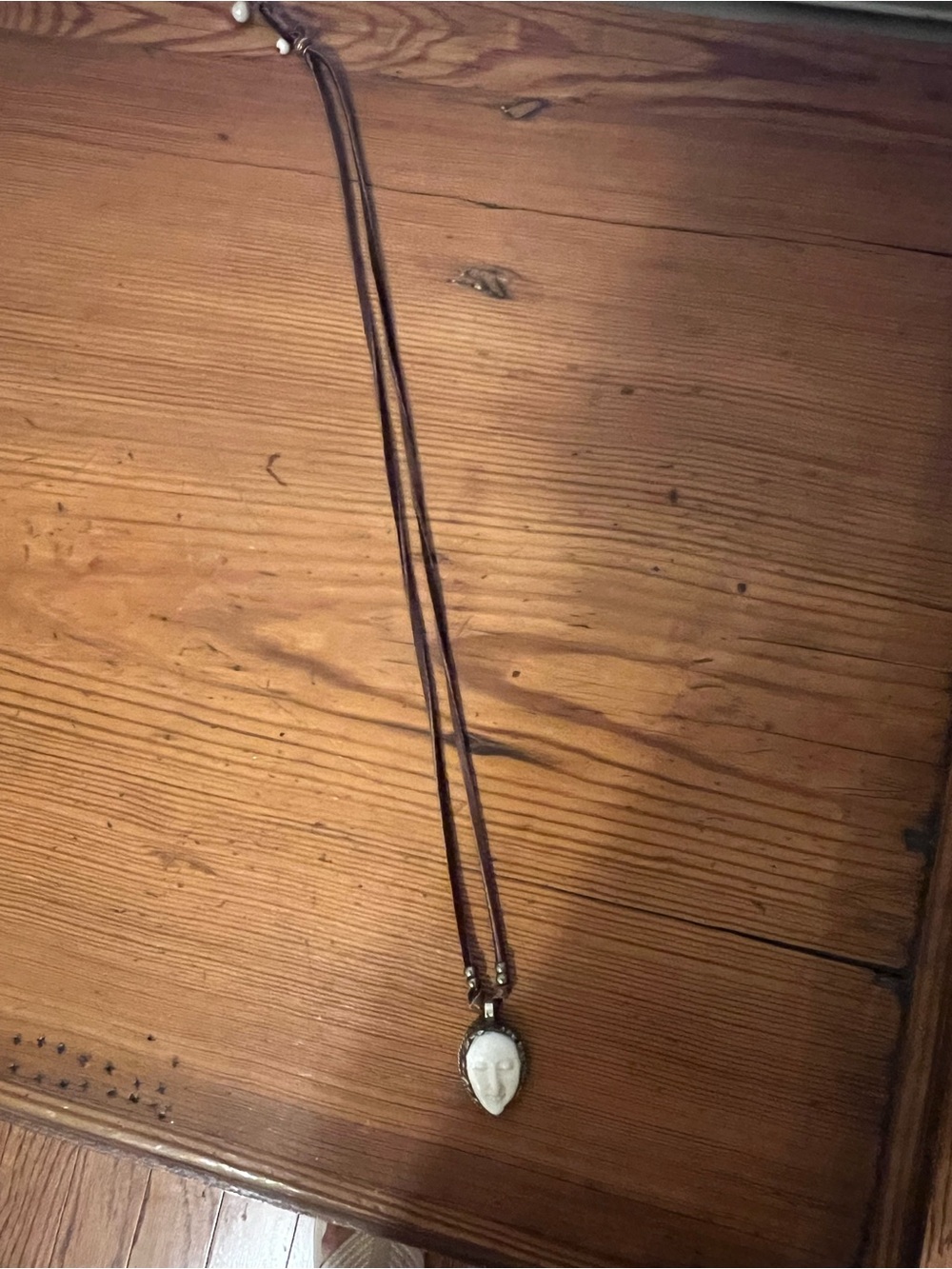 Long, bone charm necklace